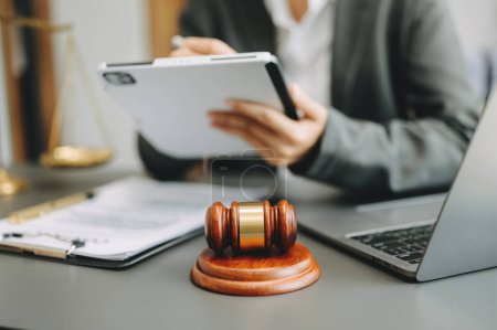Photo for Male lawyer in the office with brass scale on wooden table. justice and law concept - Royalty Free Image