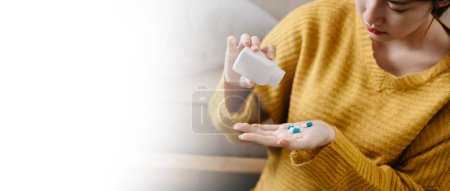 Photo for Dark haired woman in Depression eating pills. anxiety concept. Copy space - Royalty Free Image
