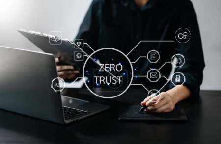 Photo for Zero trust security concept. Businesswoman using  digital tablet with zero trust icon on virtual screen of Data businesses in office - Royalty Free Image