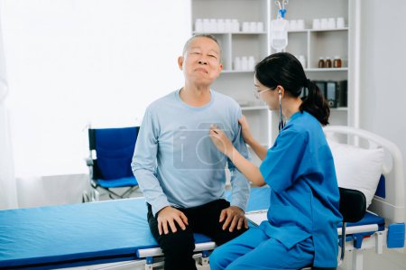 Photo for Asian doctor talking with senior patient and  receiving saline solution in hospital or clinic. - Royalty Free Image