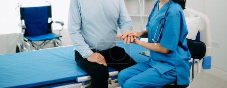 Photo for Asian doctor talking with senior patient and  receiving saline solution in hospital or clinic. - Royalty Free Image