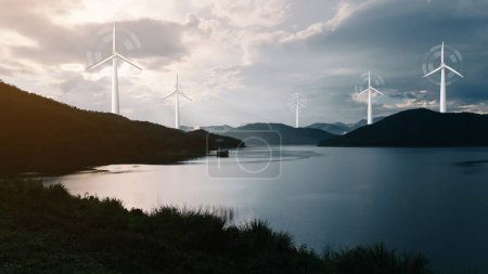Téléchargez les photos : Eco energy energy concept Moulins à vent sur la colline avec coucher de soleil.énergie propre, durable, Eco, journée de la terre, énergie verte, amour de la nature, concept d'énergie écologique - en image libre de droit