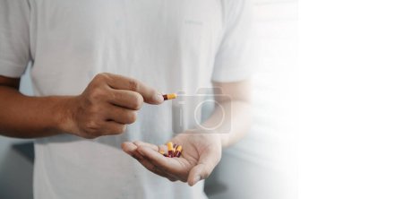 Photo for Pills in a man hands. Painful old age. Caring for the health of the elderly - Royalty Free Image