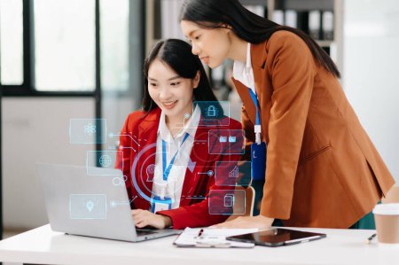 Photo for Two Women using chatbot in computer, smart intelligence Ai. Chat with AI Artificial Intelligence, developed by Open AI generate. Futuristic technology, robot in online system. in office - Royalty Free Image