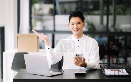 Photo for Business man using laptop for doing math finance on an office desk, tax, report, accounting, statistics, and analytical research concept in office - Royalty Free Image