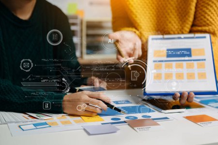 Photo for UX developer and ui designer brainstorming about mobile app interface wireframe design with customer breif and color code at modern office. - Royalty Free Image