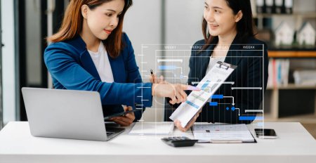 Photo for Asian business colleague business presents and explains new project. Teamwork, financial marketing team, while sitting in modern office room. - Royalty Free Image