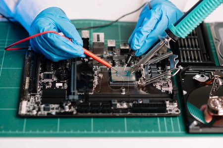 Photo for The technician repairing the motherboard in the lab with copy space. the concept of computer hardware - Royalty Free Image