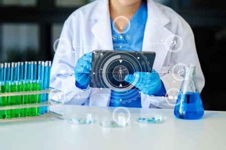Photo for Doctor working with samples and checking results on the digital tablet in laboratory - Royalty Free Image