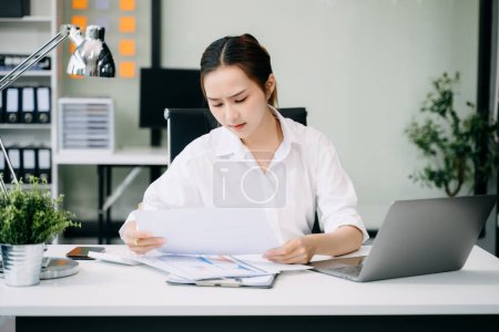 Photo for Overworked businesswoman tired after work at office with documents - Royalty Free Image