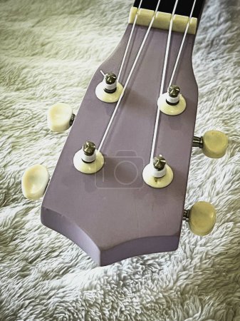 Ukulele headstock with tuning pegs made from wood,use for set up sound,parts of acoustic instrument.