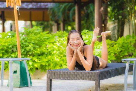 Photo for Portrait beautiful young asian woman smile relax leisure around outdoor swimming pool in hotel resort - Royalty Free Image