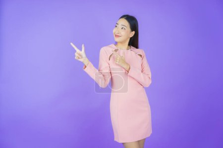 Photo for Portrait beautiful young asian woman smile with action on color background - Royalty Free Image