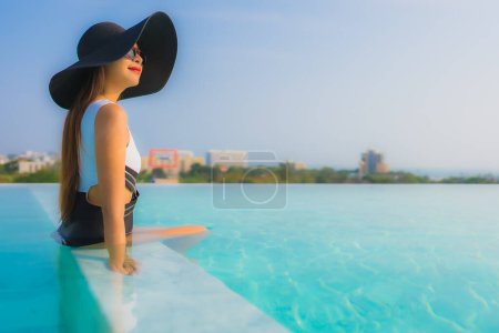 Photo for Portrait beautiful young asian woman happy smile relax around outdoor swimming pool in hotel resort for travel vacation - Royalty Free Image