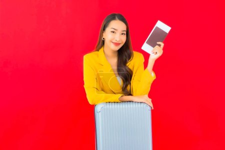 Photo for Portrait beautiful young asian woman with luggage bag passport and ticket ready for travel - Royalty Free Image