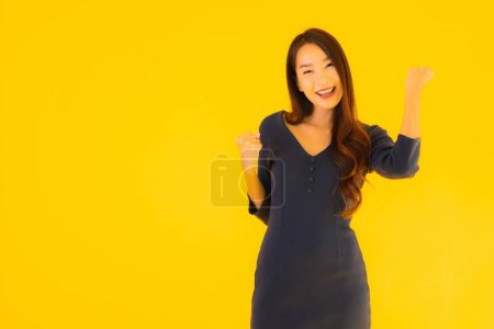 Photo for Portrait beautiful young asian woman with action on isolated yellow background - Royalty Free Image