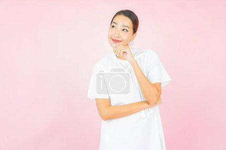 Photo for Portrait beautiful young asian woman smile with many action on pink background - Royalty Free Image