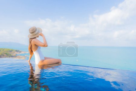 Photo for Portrait beautiful young asian woman relax smile leisure around outdoor swimming pool in hotel resort on travel vacation - Royalty Free Image