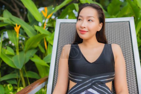Photo for Portrait beautiful young asian woman leisure relax smile around outdoor swimming pool for vacation - Royalty Free Image