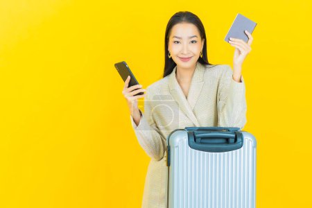 Photo for Portrait beautiful young asian woman with luggage bag and passport ready for travel - Royalty Free Image