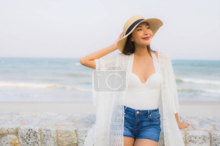 Photo for Portrait young asian woman happy smile relax around beach sea ocean for travel vacation - Royalty Free Image