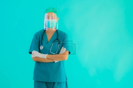 Photo for Portrait beautiful young asian doctor woman with mask and eyeglassses for protect from covid19 or coronavirus on blue isolated background - Royalty Free Image