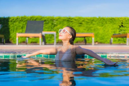 Photo for Portrait beautiful young asian woman relax smile leisure around outdoor swimming pool in hotel resort - Royalty Free Image
