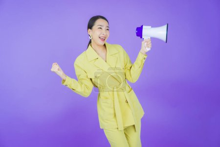 Photo for Portrait beautiful young asian woman smile with megaphone on color background - Royalty Free Image