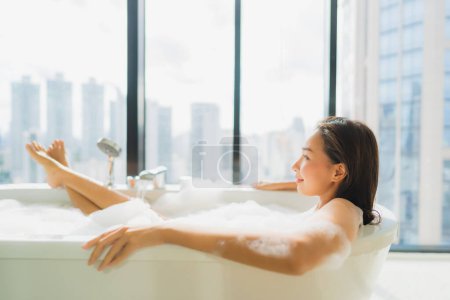 Photo for Portrait beautiful young asian woman relax and leisure in bathtub decoration in bathroom interior - Royalty Free Image