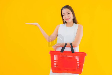 Photo for Portrait beautiful young asian woman with grocery basket for shopping from supermarket - Royalty Free Image