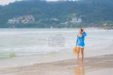 Photo for Portrait beautiful young asian woman relax leisure smile around beach sea ocean at sunset time - Royalty Free Image
