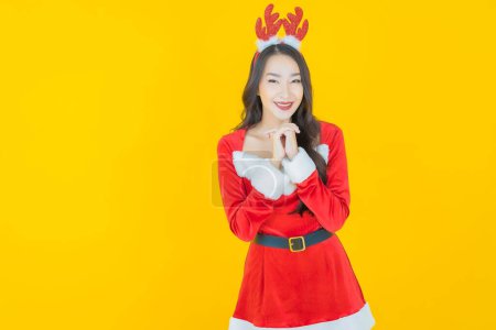 Photo for Portrait beautiful young asian woman wear christmas costume on color background - Royalty Free Image