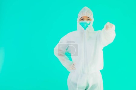 Photo for Portrait beautiful young asian doctor woman wear ppe or  personal protective equipment for protect from coronavirus or covid19 on blue isolated background - Royalty Free Image