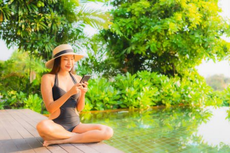 Photo for Portrait beautiful young asian woman   relax in swimming pool at hotel resort for leisure vacation trip - Royalty Free Image