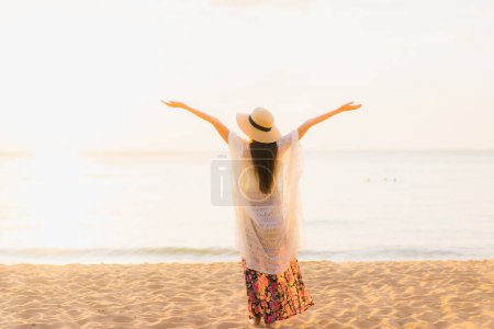 Photo for Portrait beautiful young asian women happy smile relax around beach sea ocean at sunset or sunrise time for travel vacation - Royalty Free Image