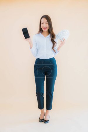 Photo for Portrait beautiful young business asian woman with cash or money on isolated background - Royalty Free Image