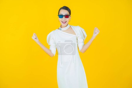 Photo for Portrait beautiful young asian woman wear 3d eyeglasses on color background - Royalty Free Image