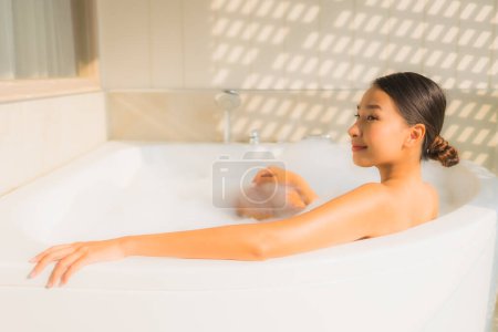 Photo for Portrait young asian woman relax take a bath in bathtub for spa concept - Royalty Free Image