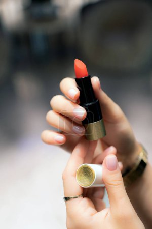 Photo for Lipstick in a woman's hand - Royalty Free Image