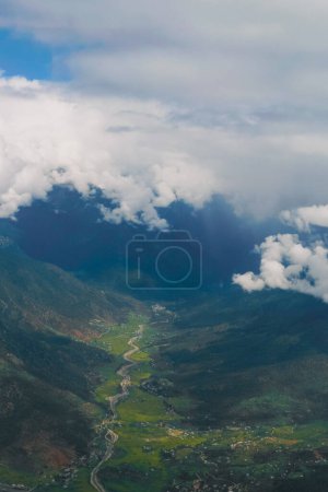 Tropical forest layers aerial view of Paro valley foggy mountain