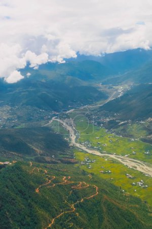 Aerial view of foggy mountains and the Paro Valley