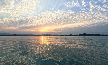 Summer sunset over waters of Kaptai lake Rangamati