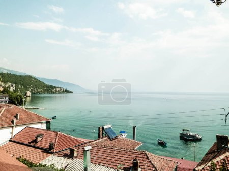 Photo for Water of lake Ochrid, Trpejca, Macedonia. Ochrid Lake is the oldest lake in Europe, known of it's clean, transparent water. Vacations and tourism concept. - Royalty Free Image