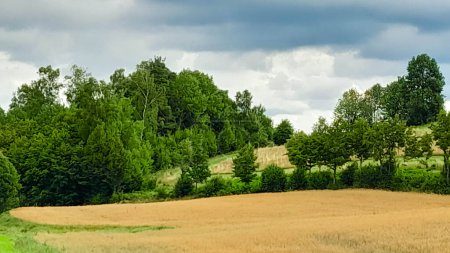 Cloudy day in Kashubia Poland. Clouds are gathering over the hills. Storm is coming. Beauty of nature of northern Poland. Pomerania Kashubia Wiezyca Region.
