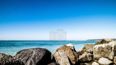 Photo for Stones on the beach in Vada, transparent, turquoise water and white sand. Travel and nature concept. - Royalty Free Image