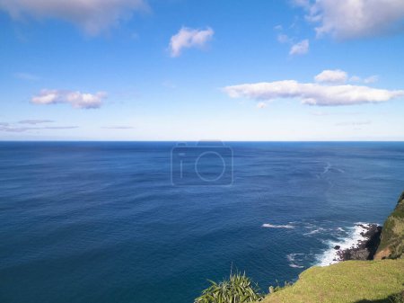 Coastal cliffs of Sao Miguel, Azores islands. Beauty of nature, copy space at blue sky.
