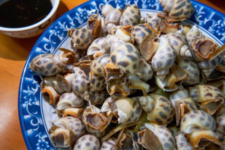 Photo for A plate of sweet and delicious boiled snails - Royalty Free Image