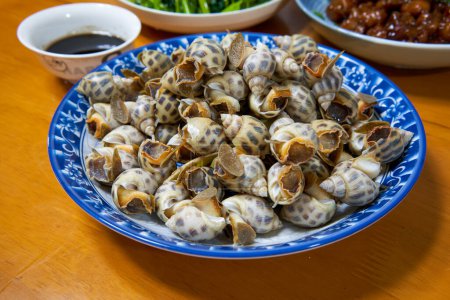 Photo for A plate of sweet and delicious boiled snails - Royalty Free Image