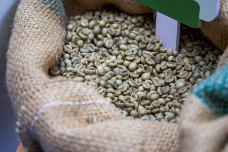 Photo for A bag of unroasted green coffee beans close-up - Royalty Free Image