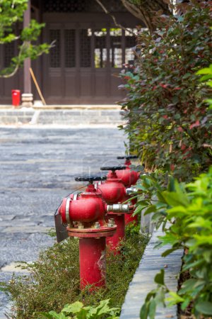 Close-up of a row of brand new fire hydrants outdoors